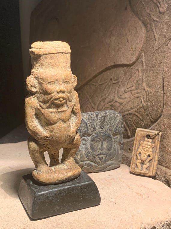 Egyptian statue of Bes and other protection amulets for home and childbirth.