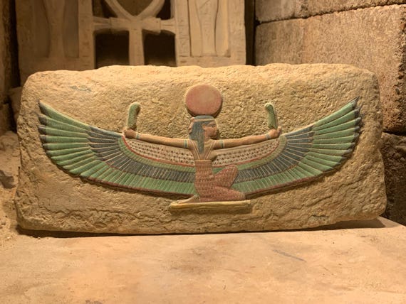 Egyptian art / wall relief sculpture of Maat the Goddess of truth, justice, balance and harmony. Egyptian mythology.
