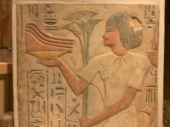 Egyptian museum replica - offering bearer from the tomb of Kheruef - 18th dynasty reign of Amenhotep III