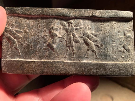 Mesopotamia Assyrian cylinder seal impression - Annunaki / Apkallu / Hero wrestling winged griffins