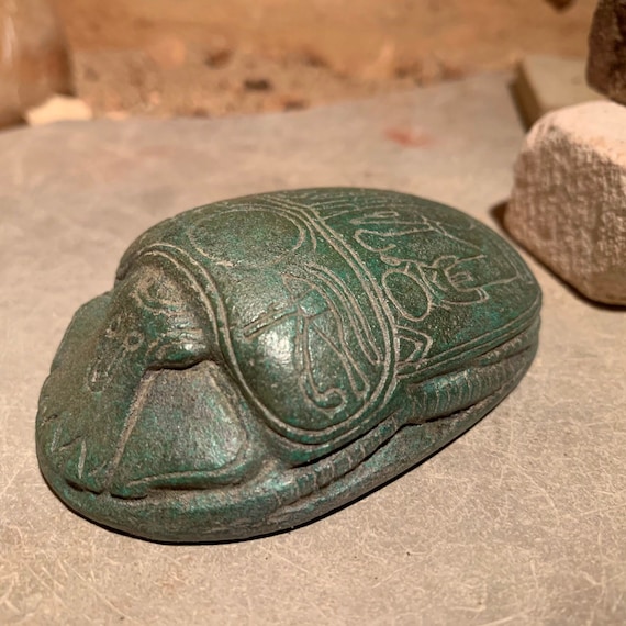 Egyptian Scarab replica featuring Osiris, Ra, Isis and Nepthys and the eyes of Horus