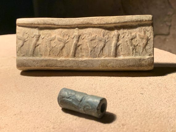 Mesopotamia Assyrian cylinder seal impression - Wrestling winged bull & griffin