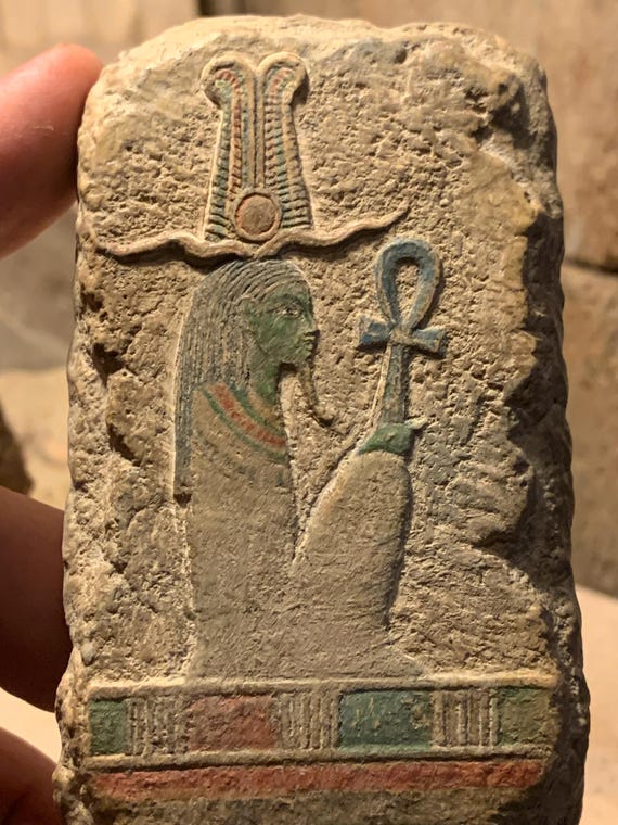 Egyptian art - painted relief sculpture of the God Osiris. Mythology of ancient Egypt. Supreme deity of the afterlife