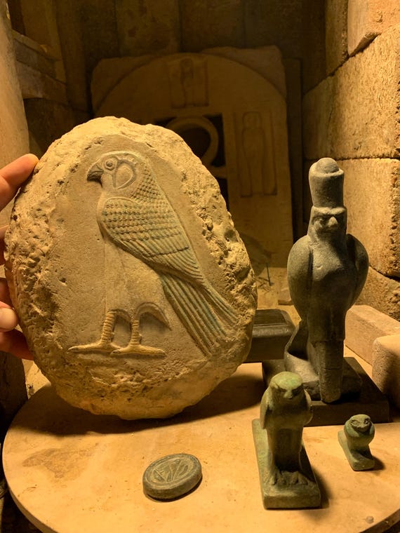 Egyptian statue set - Horus the sky god. 3 figures + amulet & mounted relief sculpture