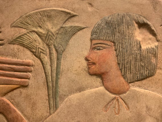 Egyptian museum replica - offering bearer from the tomb of Kheruef - 18th dynasty reign of Amenhotep III