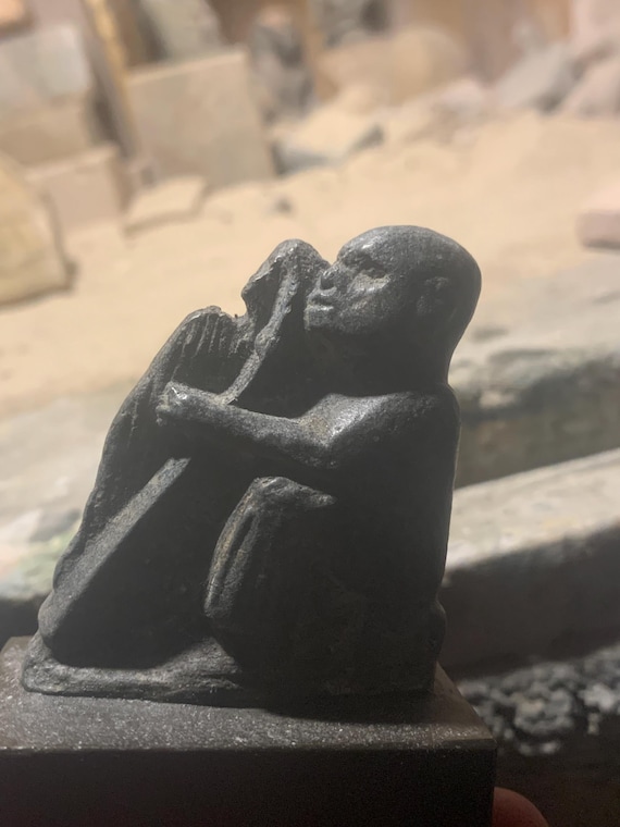 Egyptian art - statue of a revered blind harpist. Domestic sculpture of Ancient Egypt