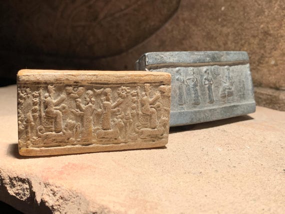 Sumerian and Assyrian cylinder seal impressions x 2 - Ur Nammu and Ishtar. Mesopotamia