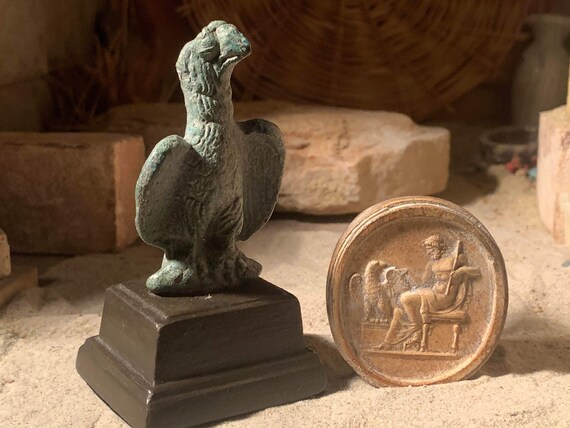 Zeus and Aquila Ancient Greek / Roman art. Eagle statue and amulet. Carrier of lightning bolts.