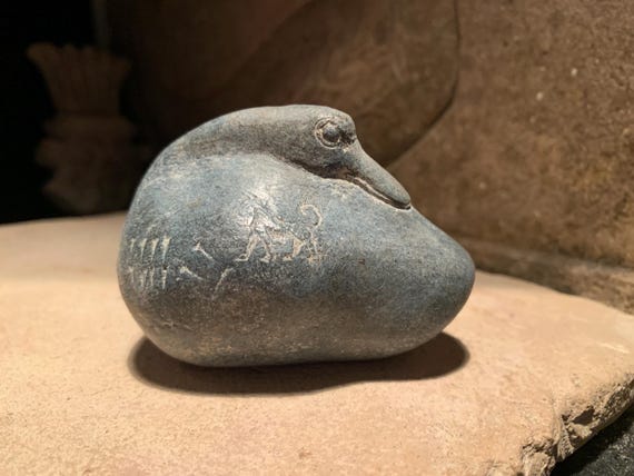 Sumerian duck weight featuring a lioness. Mesopotamian art. Cuneiform