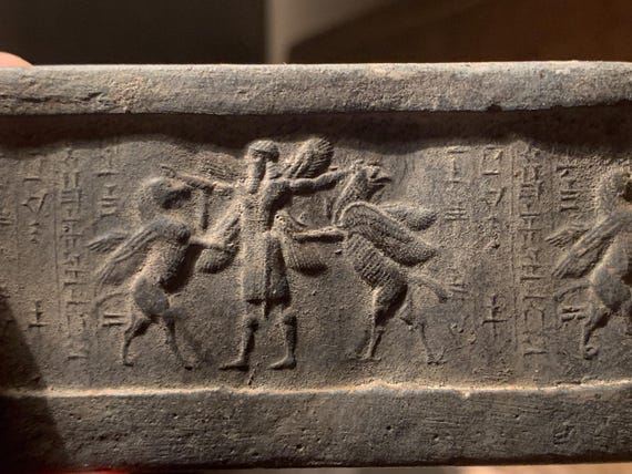 Mesopotamia Assyrian cylinder seal impression - Annunaki / Apkallu / Hero wrestling winged griffins