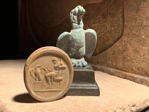 Zeus and Aquila Ancient Greek / Roman art. Eagle statue and amulet. Carrier of lightning bolts.
