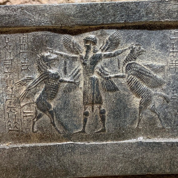 Mesopotamia Assyrian cylinder seal impression - Annunaki / Apkallu / Hero wrestling winged griffins