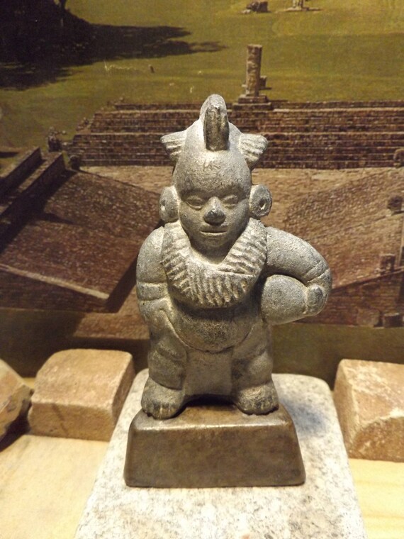 Aztec / Mayan statue replica of a ball player. Pre-columbian origins of football