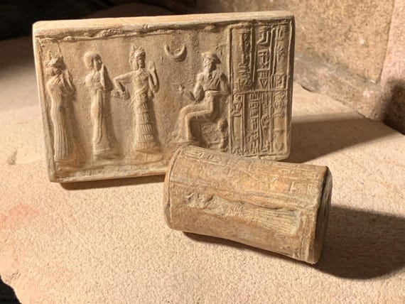 Sumerian cylinder seal of Ur Nammu. Museum replica tablet set. Mesopotamian art.