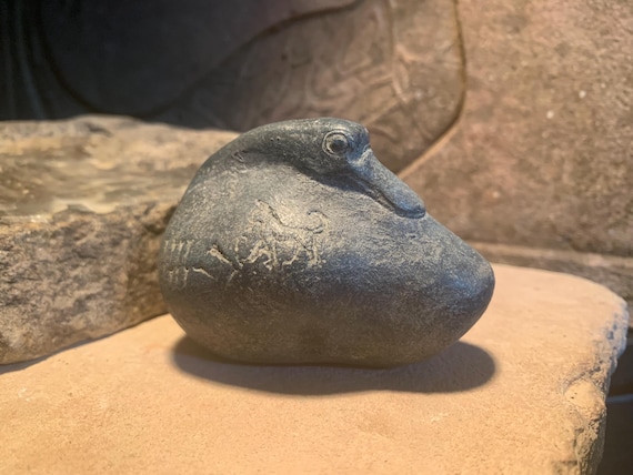 Sumerian duck weight featuring a lioness. Mesopotamian art. Cuneiform