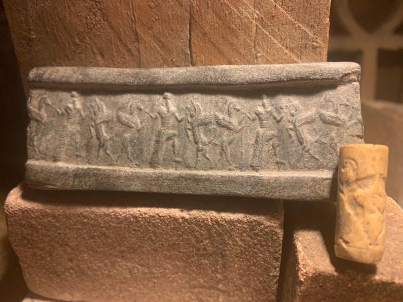 Mesopotamia Assyrian cylinder seal impression - Wrestling winged bull & griffin