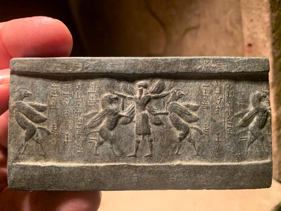 Mesopotamia Assyrian cylinder seal impression - Annunaki / Apkallu / Hero wrestling winged griffins