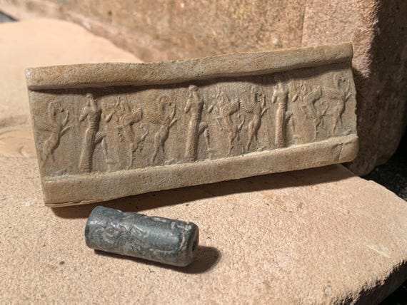 Mesopotamia Assyrian cylinder seal impression - Wrestling winged bull & griffin