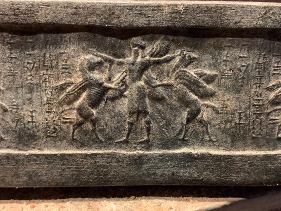 Mesopotamia Assyrian cylinder seal impression - Annunaki / Apkallu / Hero wrestling winged griffins