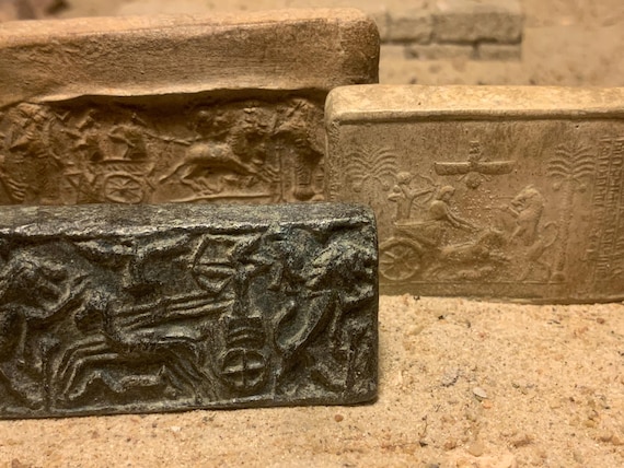 Cylinder seal impressions from ancient Ugarit & Persia. Early depictions of the chariot. Mesopotamia.