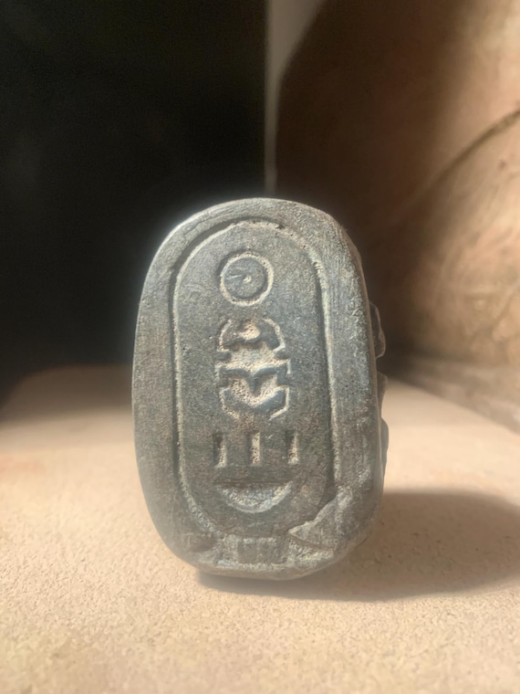 Egyptian art - King Tutankhamun scarab amulet featuring his name in hieroglyphs
