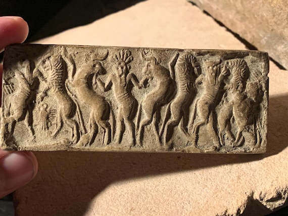 Sumerian cylinder seal impression - Master of animals. Museum replica