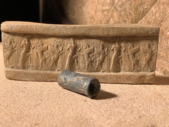 Mesopotamia Assyrian cylinder seal impression - Wrestling winged bull & griffin
