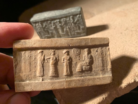 Sumerian and Assyrian cylinder seal impressions x 2 - Ur Nammu and Ishtar. Mesopotamia
