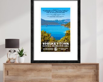 May include: A vintage travel poster for Whiskeytown National Recreation Area in California. The poster features a scenic view of a lake surrounded by lush green trees and mountains. The text on the poster reads "Sparkling Waters, Cool Forests, Waterfalls - Nestled Among The Klamath Mountains" and "Whiskeytown National Recreation Area".