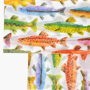 May include: A white background with a repeating pattern of colorful watercolor fish. The fish are in various shades of orange, yellow, green, blue, and pink. The fish are all facing different directions and some are overlapping.