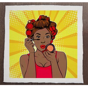 May include: A woman with brown hair in rollers is applying makeup. She is wearing a red tank top and has a bright yellow background with white polka dots.