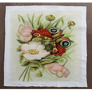 May include: A vintage illustration of a butterfly with red, yellow, and blue wings perched on white and pink flowers with green leaves.