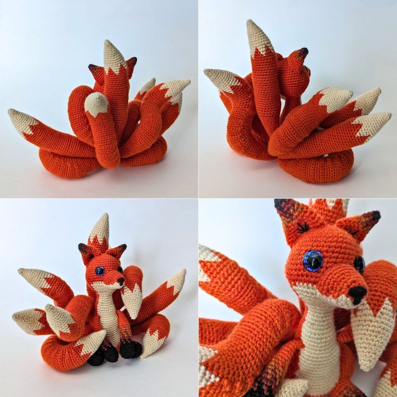 May include: A crocheted orange fox with nine tails, featuring cream-colored tips. The fox has blue eyes, a cream-colored chest, and black accents. This handmade plush toy is a unique decorative item.