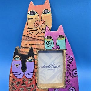 May include: A set of three ceramic mugs with a speckled, matte finish. The mugs are in shades of cream, light gray, and dark gray. Each mug has a simple, minimalist design, perfect for coffee or tea.