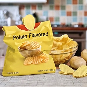May include: A yellow bag of potato chips with the words "Potato Flavored" printed on it. The bag is sealed with a chip-shaped clip. A bowl of chips and loose chips are visible, along with potatoes. The bag is labeled "Potato Chips" and "Net Wt. 10 oz (283.5 g)."