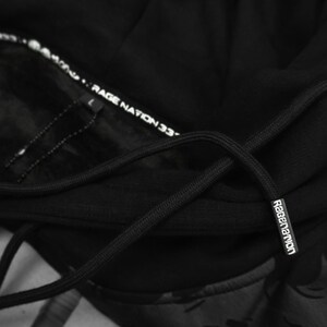 May include: Black hooded sweatshirt with a black drawstring and a white "Ragenation 33" label on the inside of the hood.