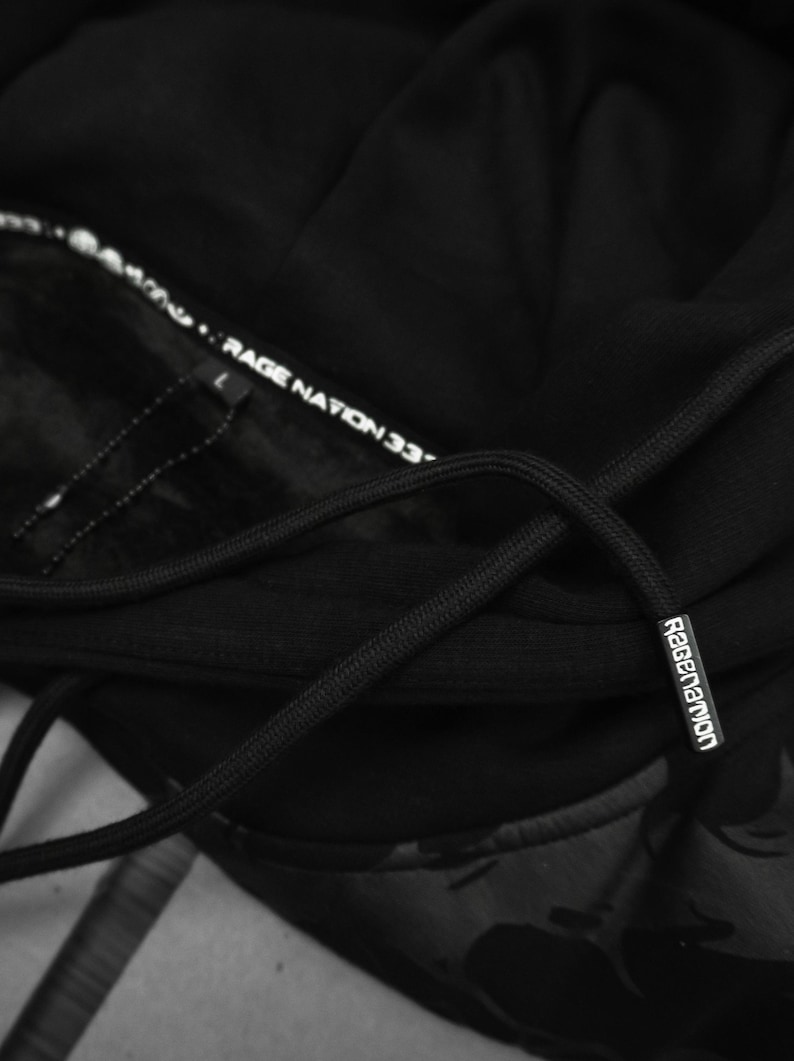 May include: Black hooded sweatshirt with a black drawstring and a white "Ragenation 33" label on the inside of the hood.