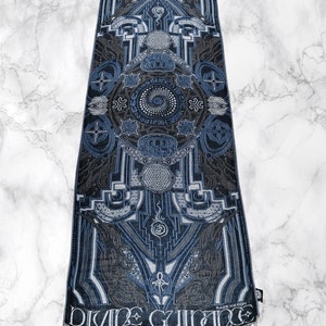 May include: A blue and gray patterned scarf with a geometric design and the text "DIVINE GUIDANCE" and "RAGE NATION".