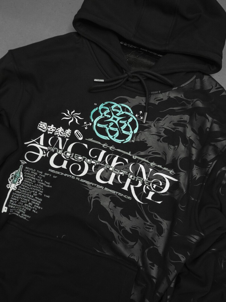 May include: Black hooded sweatshirt with a graphic print of a swirling design and the text "Ancient Future" and "RESONATE CREATOR EXISTENCE". The design is in white and teal.