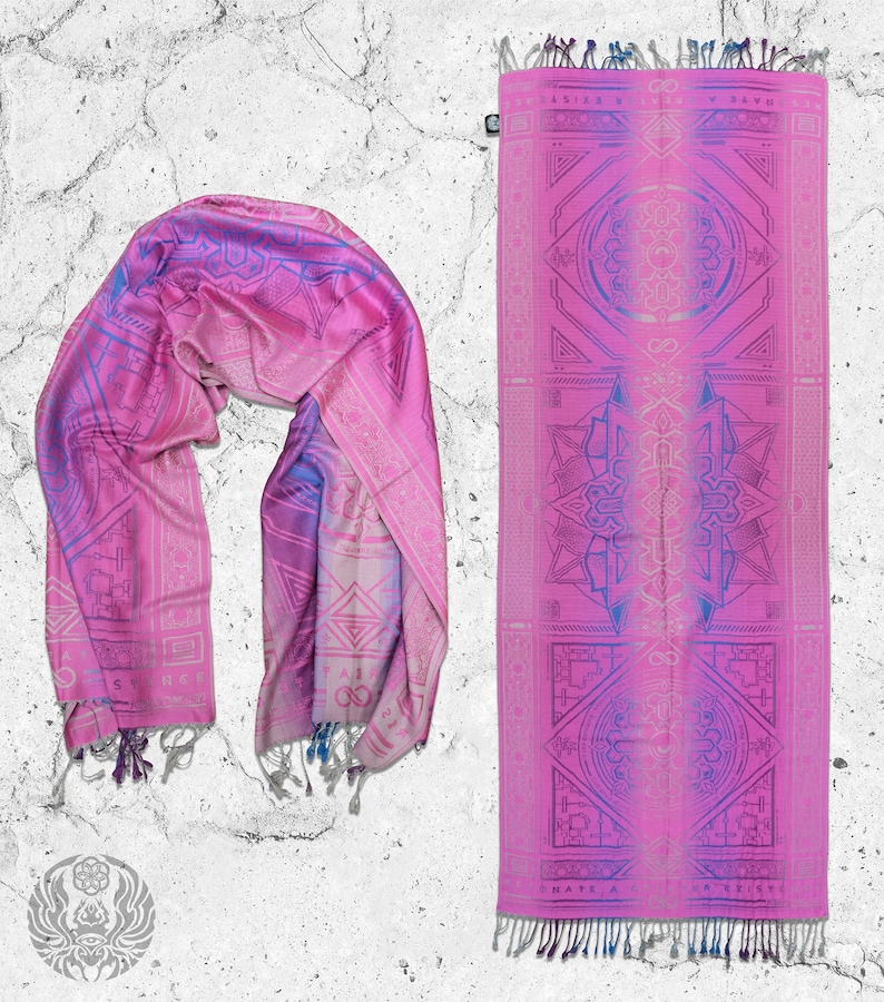 May include: A pink and purple patterned silk scarf with a geometric design. The scarf is folded in half and has a fringe on the ends. The scarf is laid out on a white textured background.