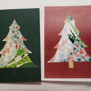 May include: Two Christmas cards featuring a tree design. The trees are cut out and filled with patterned paper in various colors, including green, red, and white. One card has a dark green background, and the other has a red background.