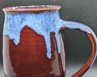 Handmade pottery coffee mug drippy blue over red