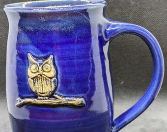 Handmade Pottery coffee mug, featuring an owl on a log in Cobalt blue. approximately 18oz handmade ceramic mug made to order