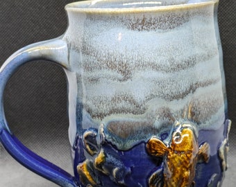 pottery handmade coffee mug fisherman coffee mug,   fish jumping out of water