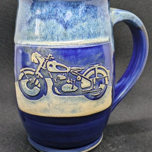 Pottery coffee mug featuring a motorcycle in burnt orange and brown or, black and blue approx. 16 oz.