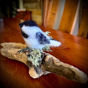 Felted bird on driftwood