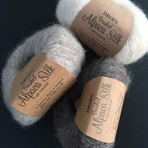 DROPS Brushed Alpaca Silk A luxurious blend of brushed alpaca and mulberry silk Flyffy worsted lace yarn Aran yarn Drops design
