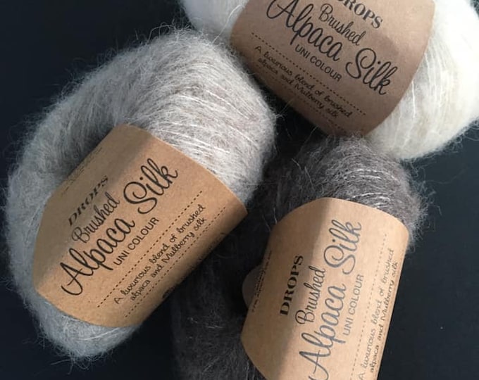 DROPS Brushed Alpaca Silk A luxurious blend of brushed alpaca and mulberry silk Flyffy worsted lace yarn Aran yarn Drops design