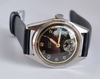 Seltene Schweizer 1950 Svalan Sportsman Military ETA 900 Mechanische Uhr mit schwarzem Zifferblatt