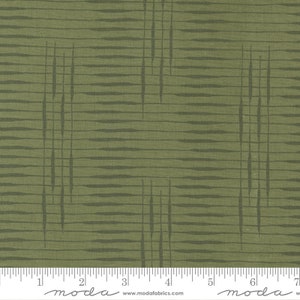 May include: Green fabric with a geometric pattern of thin, dark green lines. The fabric is textured and has a subtle sheen. The fabric is measured in inches with a ruler.